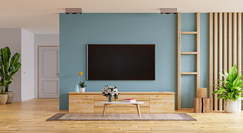 TV LED on the cabinet in modern living room on blue wall background,3d rendering